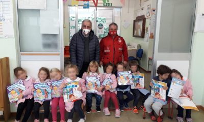 Foto bambini della R. Kipling con Croce Rossa, donazione libri
